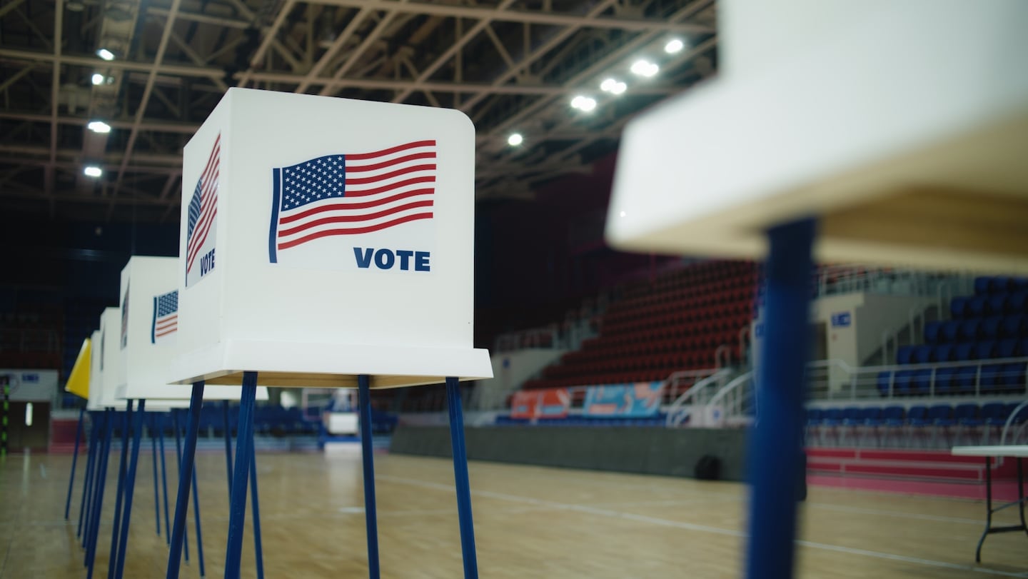 A stock image of a voting booth.