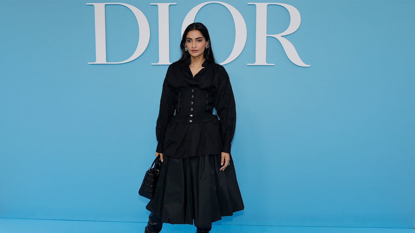 Indian actress Sonam Kapoor poses upon arrival ahead of Dior Women Ready-to-wear Spring-Summer 2025 show as part of the Paris Fashion Week