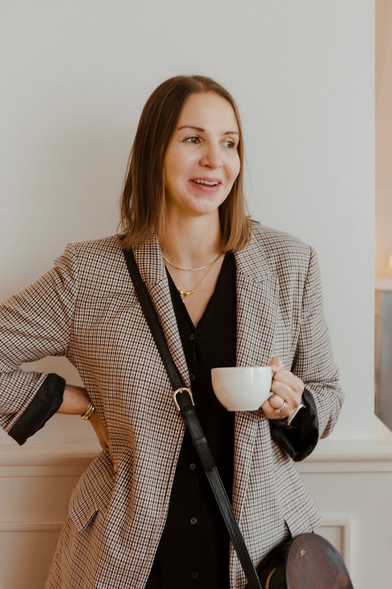 Headshot of Leanne Phipps, finance director at Missoma, holding a coffee cup.