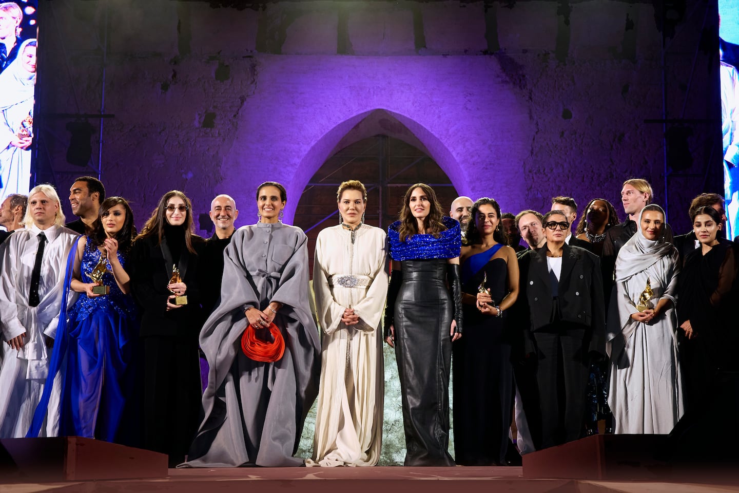 Fashion Trust Arabia co-founders welcome the 2024 prize winning designers, finalists and jury members on stage at the Qatari fund's 2024 gala event at El Badi Palace on October 24, 2024 in Marrakech, Morocco.