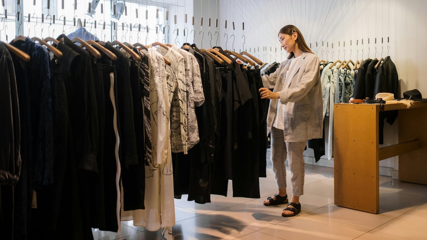 A fashion retail worker on the shop floor.