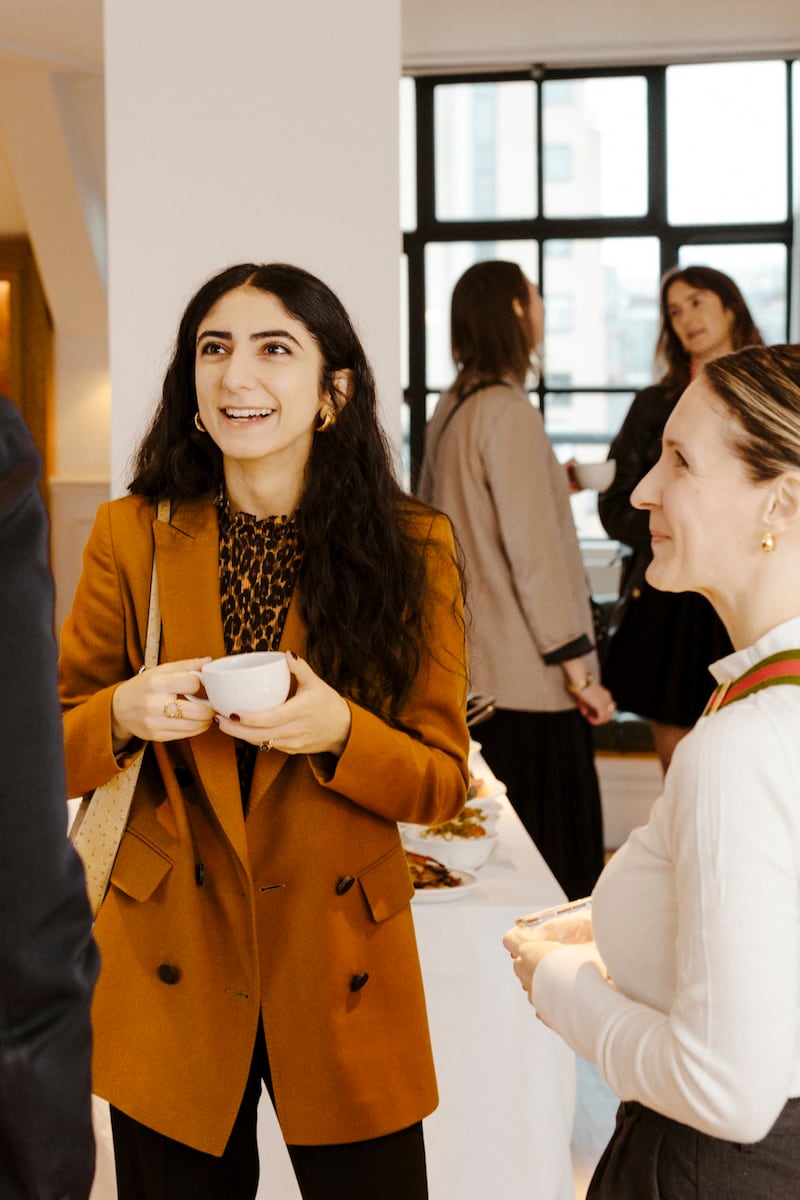 Image of Sona Abaryan, partner at Ekimetrics, holding a coffee cup.