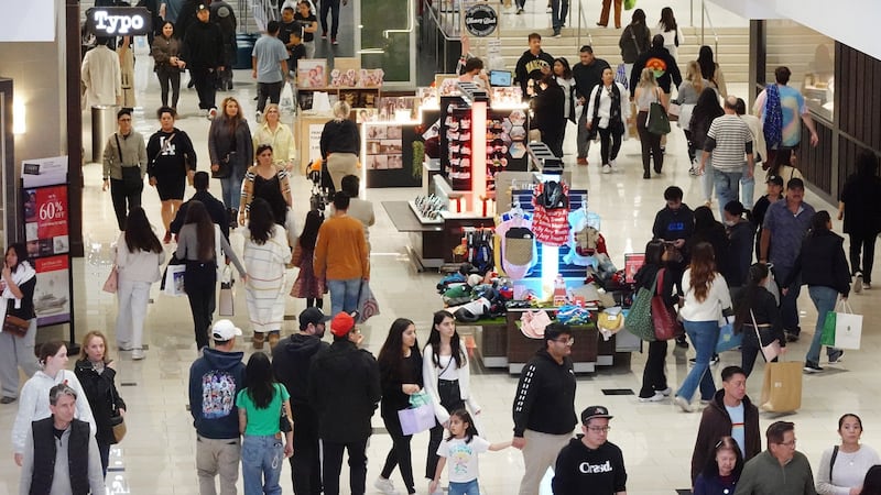 Shoppers inside a busy mall.