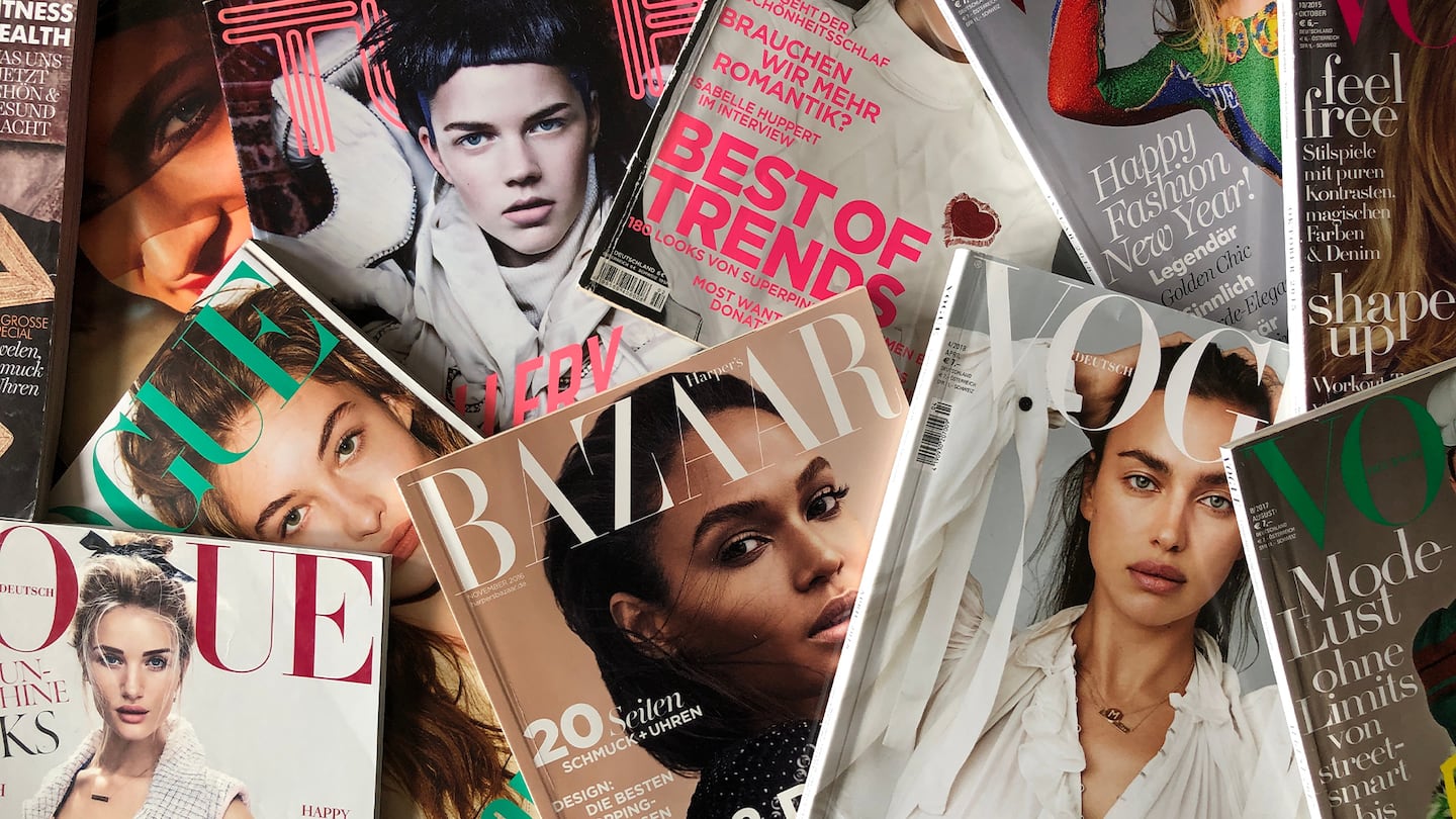 Magazines sprawled over a table