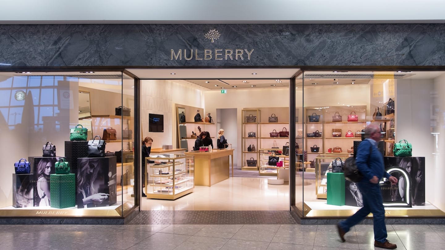 A shopper walks past a Mulberry store.