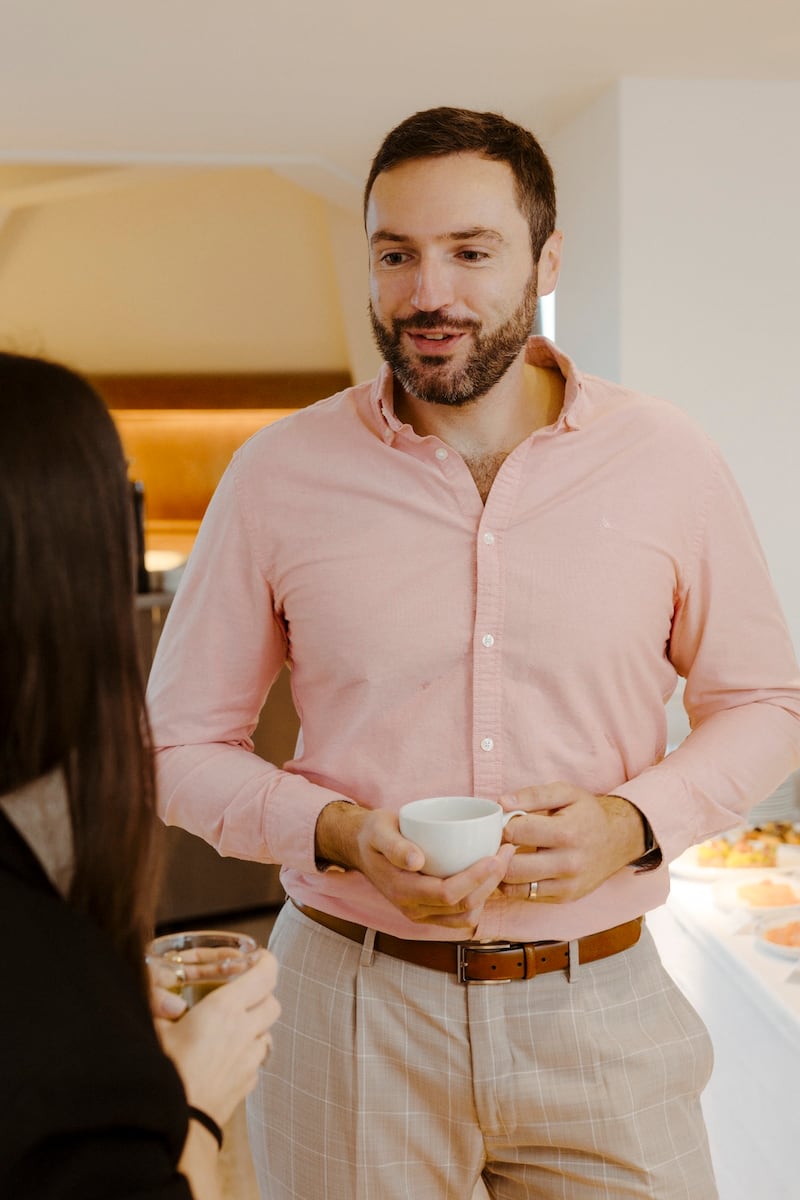 Headshot of Matt Andrew, partner at Ekimetrics, holding a coffee cup.