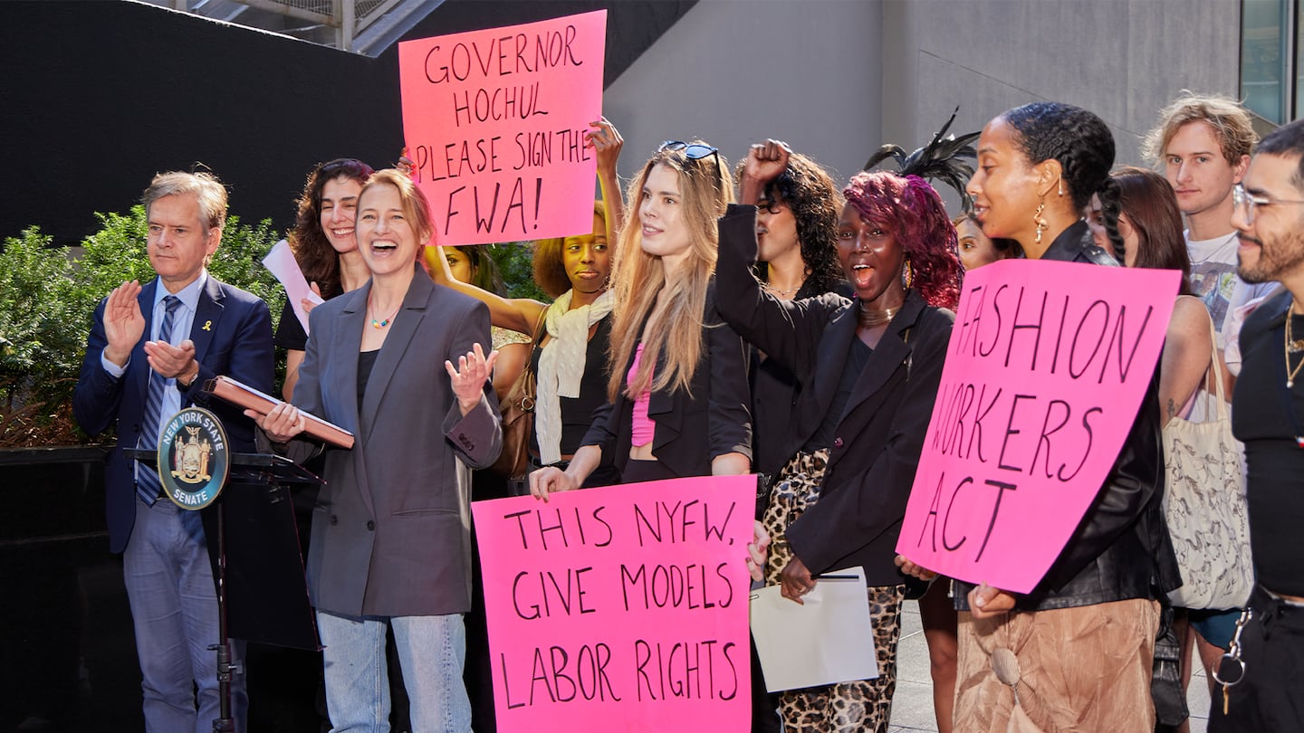 A gathering of people with signs